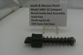 Smith & Wesson pistol recoil guide rod assembly with a label on a white surface