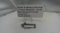 Smith & Wesson Revolver J Frame Model 63 .22 LR bolt spring and plunger on a white surface with a label.