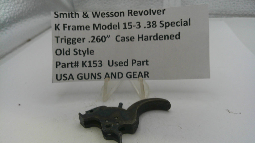 Smith & Wesson revolver trigger with descriptive label on a white background