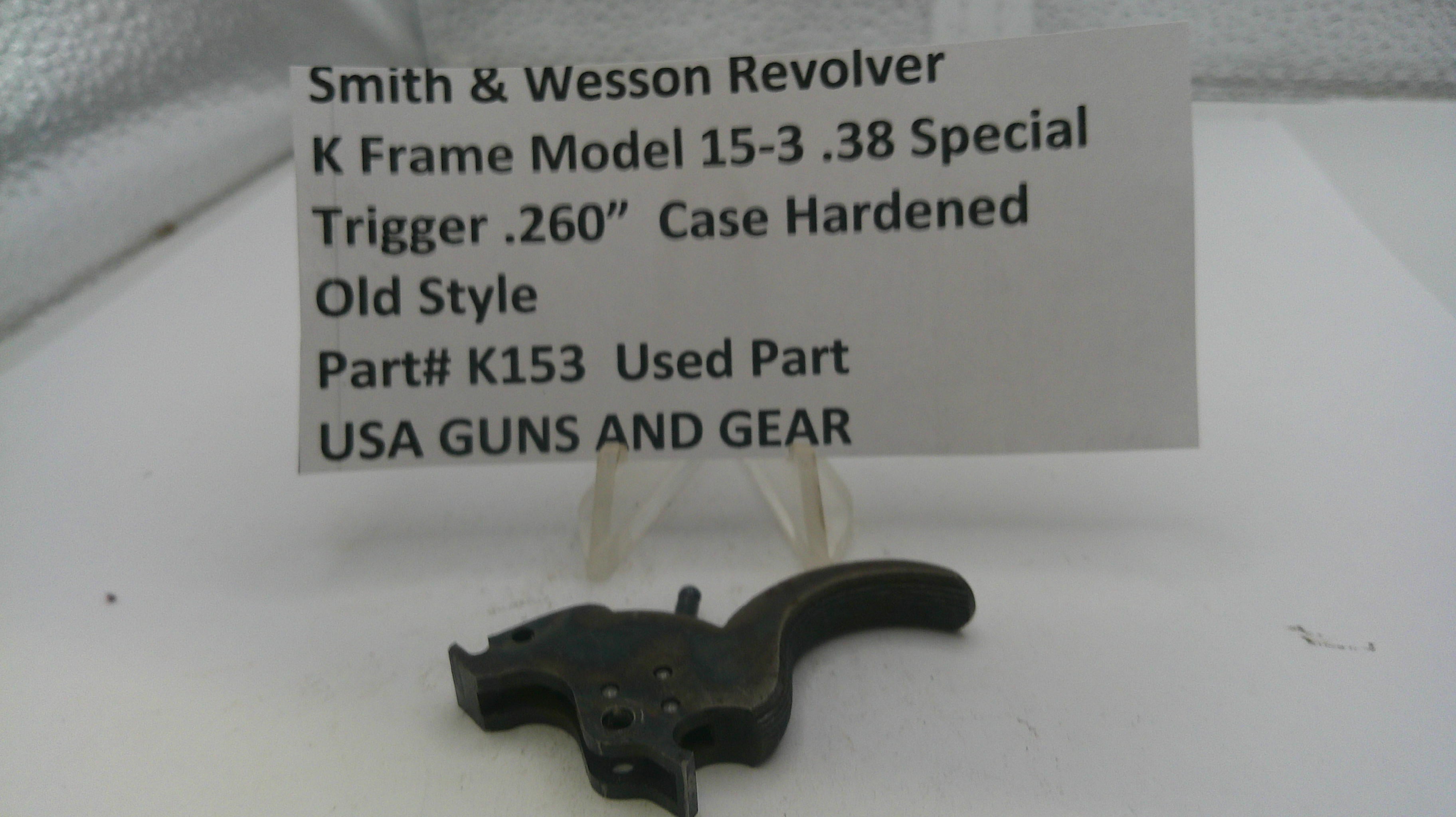 Smith & Wesson revolver trigger with descriptive label on a white background