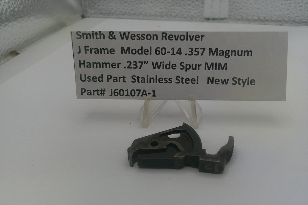 Smith & Wesson revolver part on a white surface with a label detailing specifications.