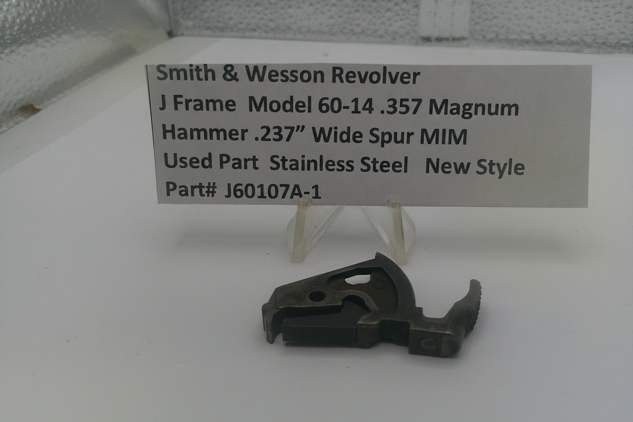 Smith & Wesson revolver part on a white surface with a label detailing specifications.