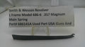 Smith & Wesson revolver part with descriptive label on a white background