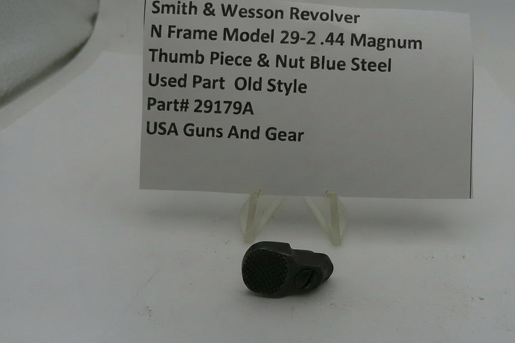 Smith & Wesson revolver thumb piece and nut with a price tag on a white background