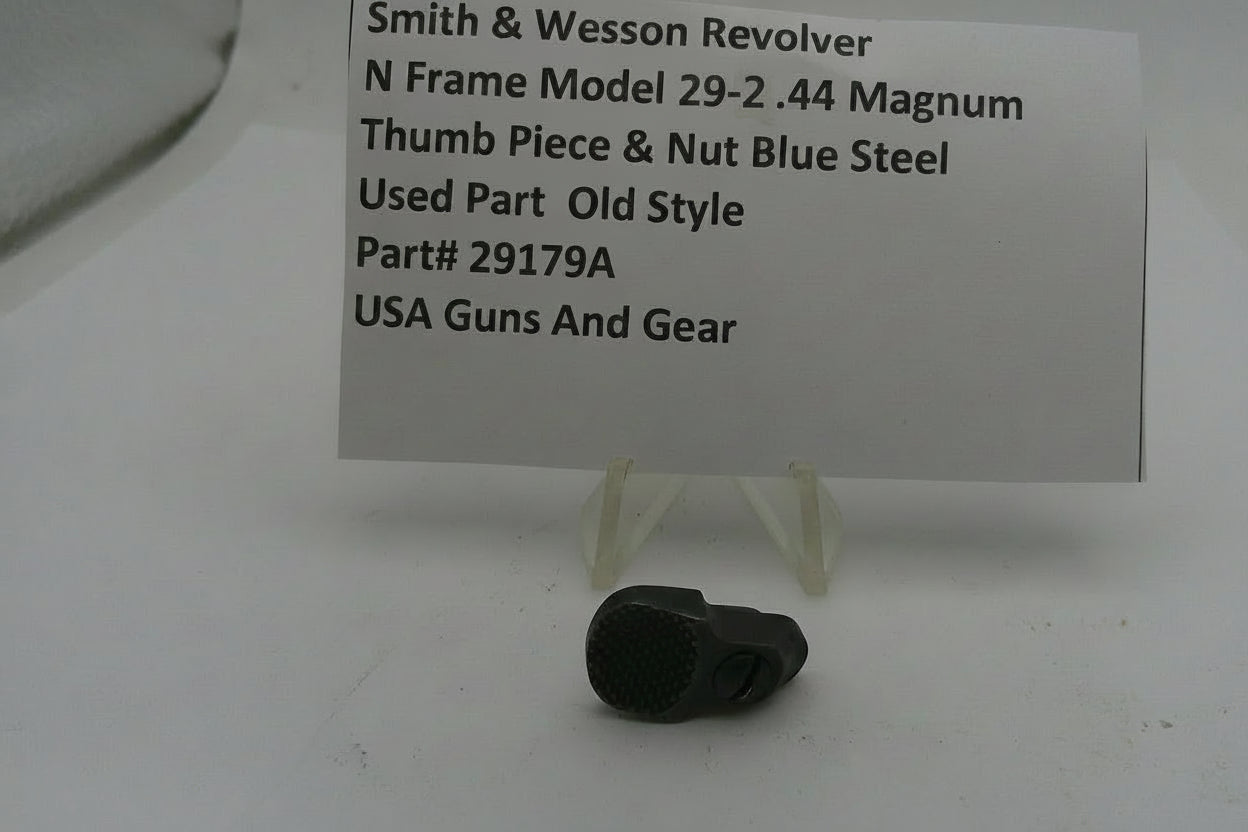 Smith & Wesson revolver thumb piece and nut with a price tag on a white background