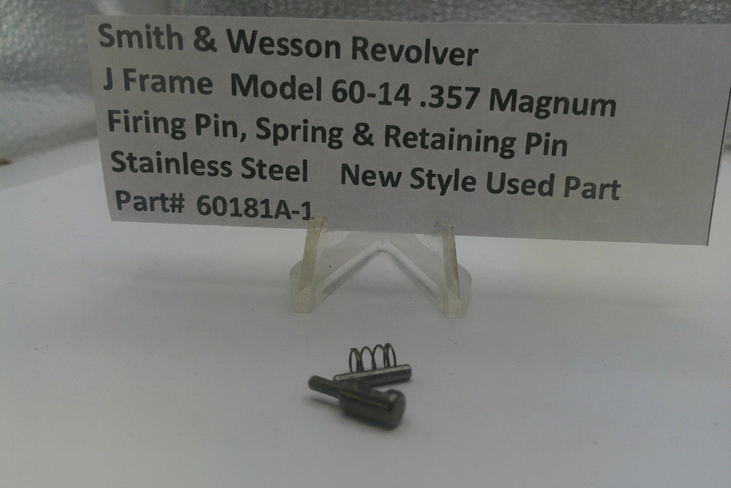 Smith & Wesson revolver firing pin and spring on a white background with a label.