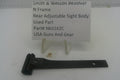 A black metal rear adjustable sight body part for a Smith & Wesson revolver, displayed on a white surface with a small sign behind it reading 'Smith & Wesson Revolver N Frame Rear Adjustable Sight Body Used Part Part# Nkit162A USA Guns And Gear'.
