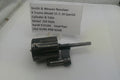 Smith & Wesson revolver part on a white background with a label