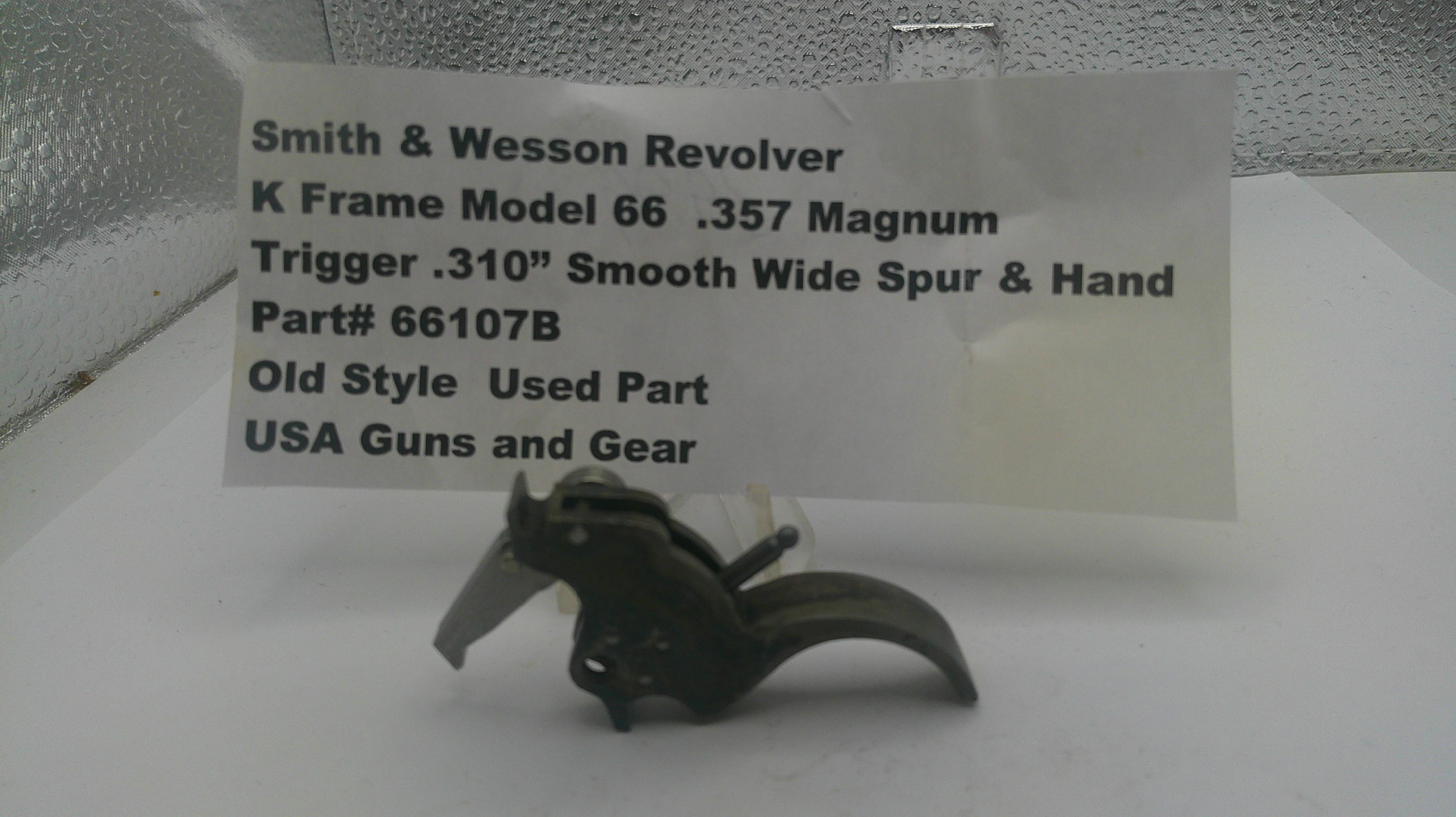 Smith & Wesson revolver trigger part with descriptive label on a white background