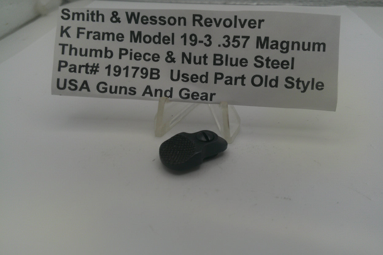 Black thumb piece and nut with a label detailing product information on a white background