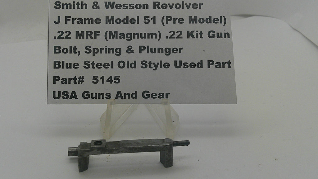 A used metal firearm part for a Smith & Wesson revolver, displayed on a clear plastic stand with a white label card behind it. The label reads 'Smith & Wesson Revolver J Frame Model 51 (Pre Model) .