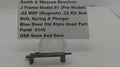 A used metal firearm part for a Smith & Wesson revolver, displayed on a clear plastic stand with a white label card behind it. The label reads 'Smith & Wesson Revolver J Frame Model 51 (Pre Model) .
