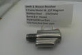 Smith & Wesson revolver barrel on a white background with a label