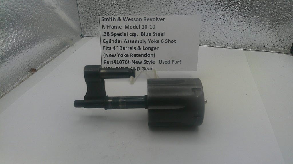 Smith & Wesson revolver part on a white surface with a label