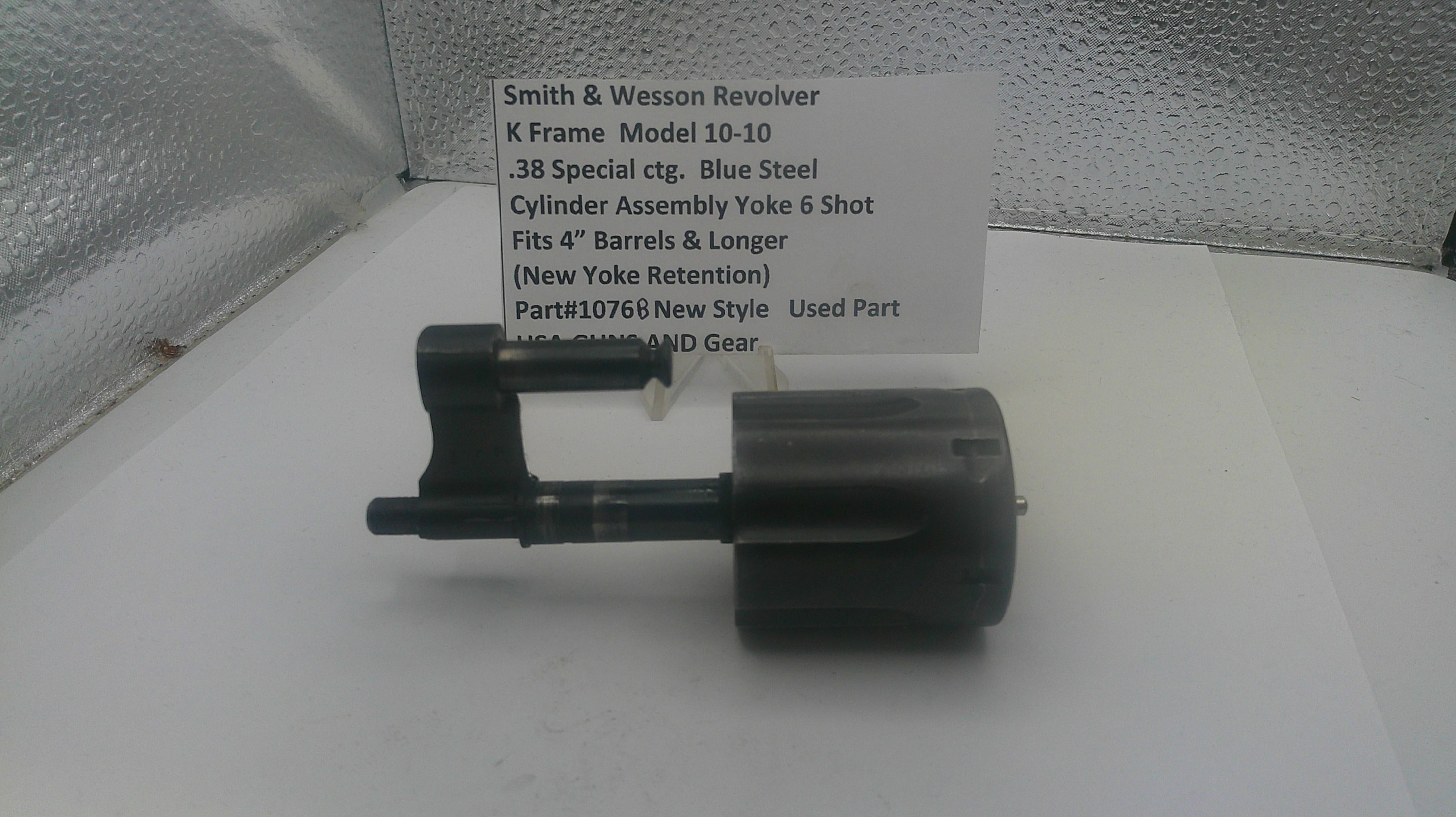 Smith & Wesson revolver part on a white surface with a label