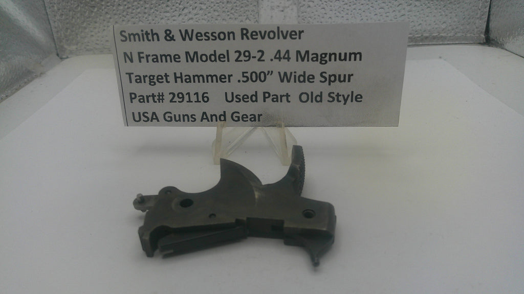 Smith & Wesson revolver part with a label on a white background