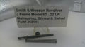 Smith & Wesson revolver parts including mainspring, stirrup, and swivel on a stand with a label.