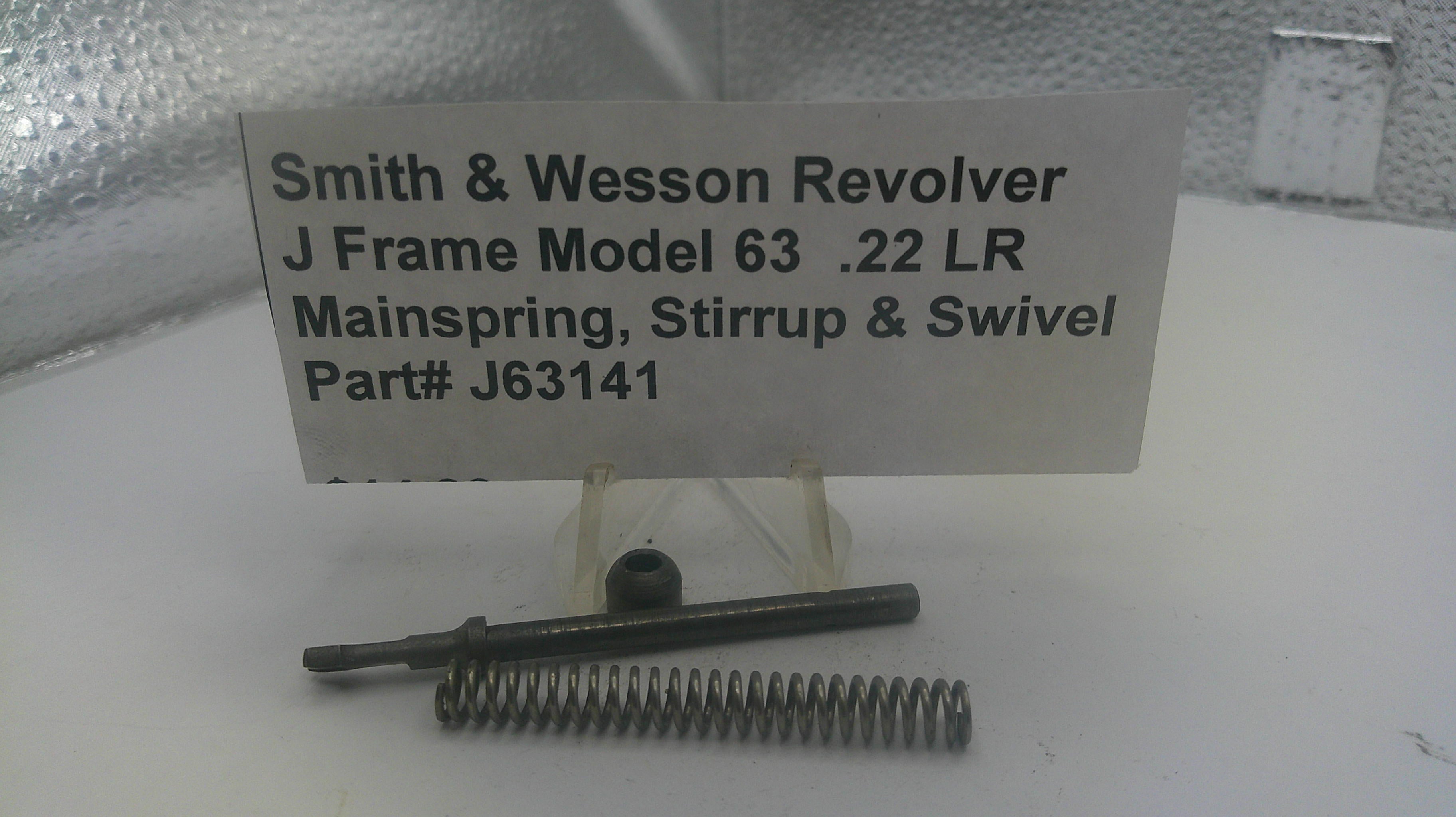 Smith & Wesson revolver parts including mainspring, stirrup, and swivel on a stand with a label.
