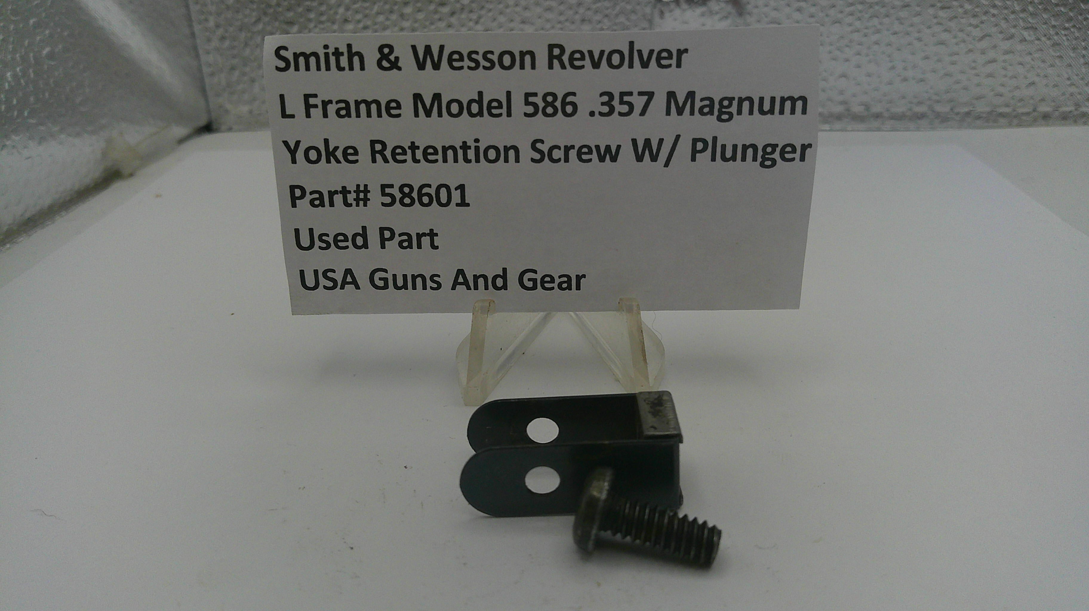 Yoke retention screw with plunger and label for Smith & Wesson Revolver on a white surface.