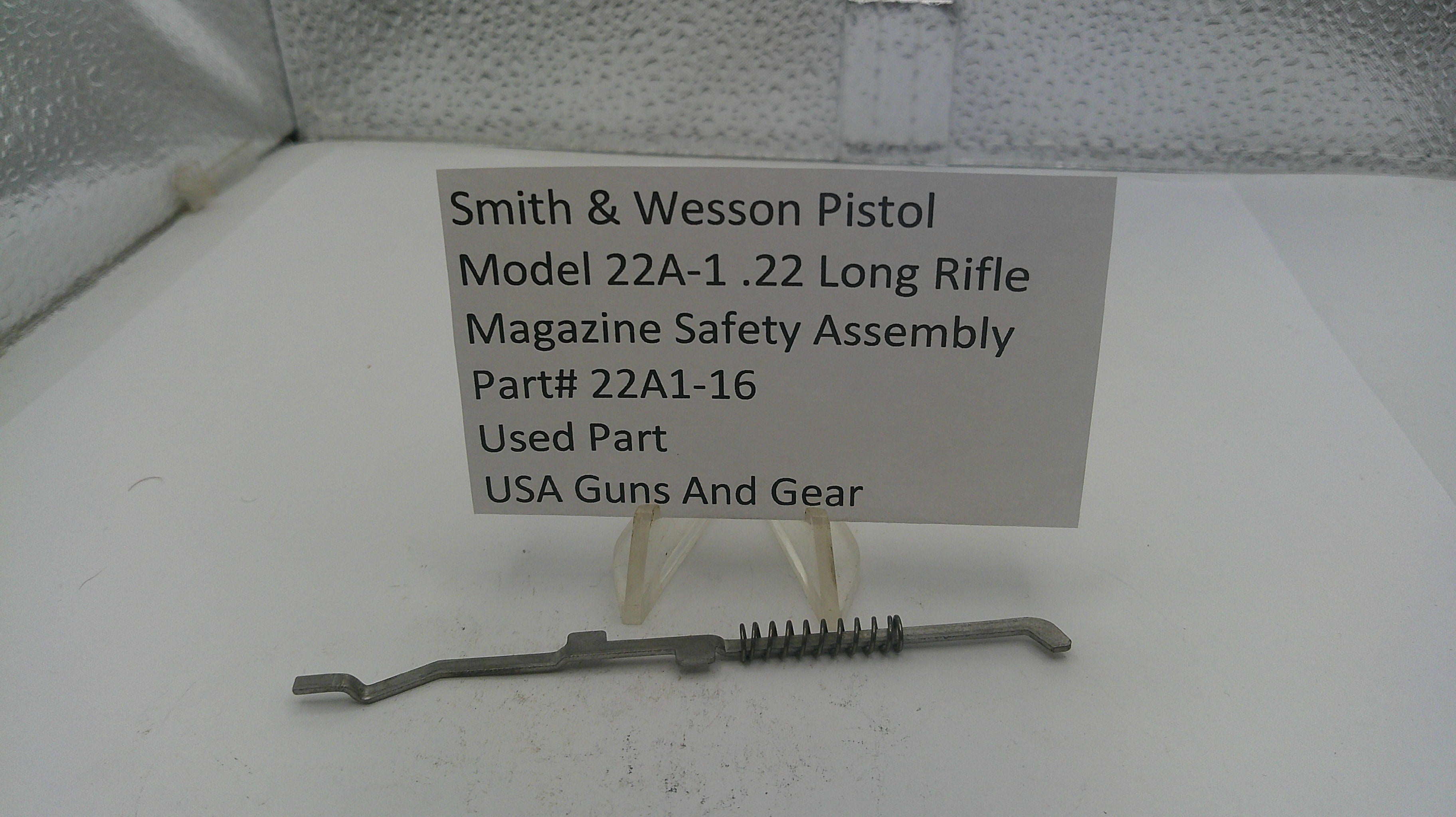Smith & Wesson pistol magazine safety assembly on a white surface with a label.