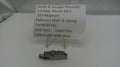Smith & Wesson revolver part with descriptive card on a white surface