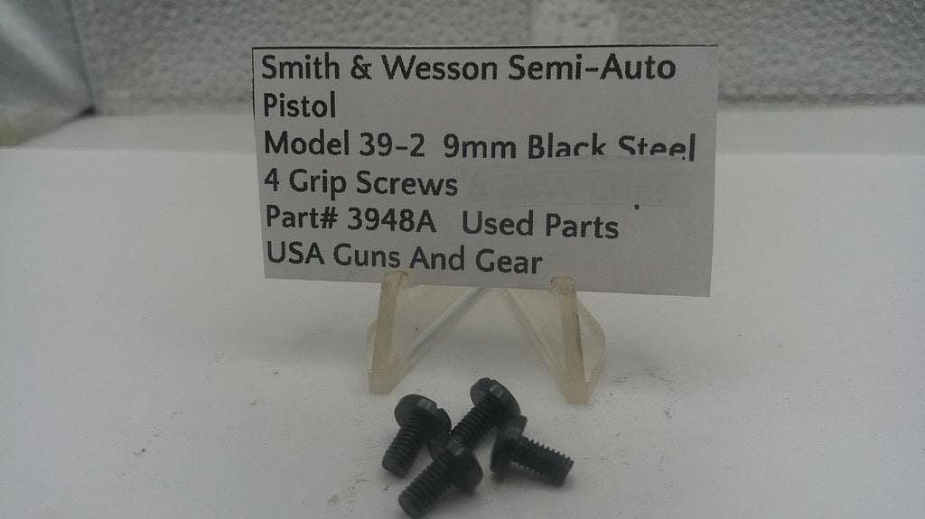 Black grip screws for Smith & Wesson semi-auto pistol on a white background with a label.