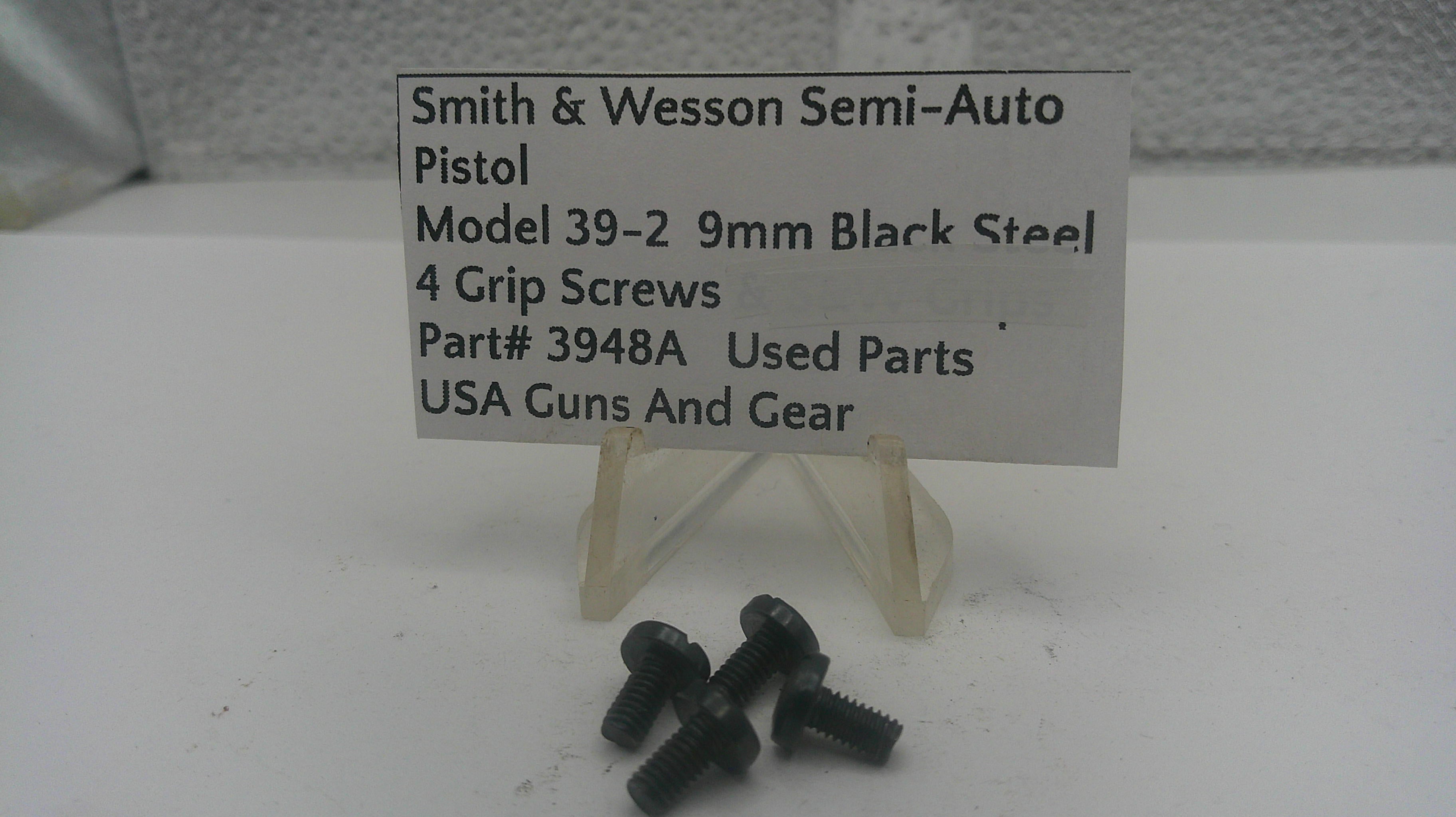 Black grip screws for Smith & Wesson semi-auto pistol on a white background with a label.