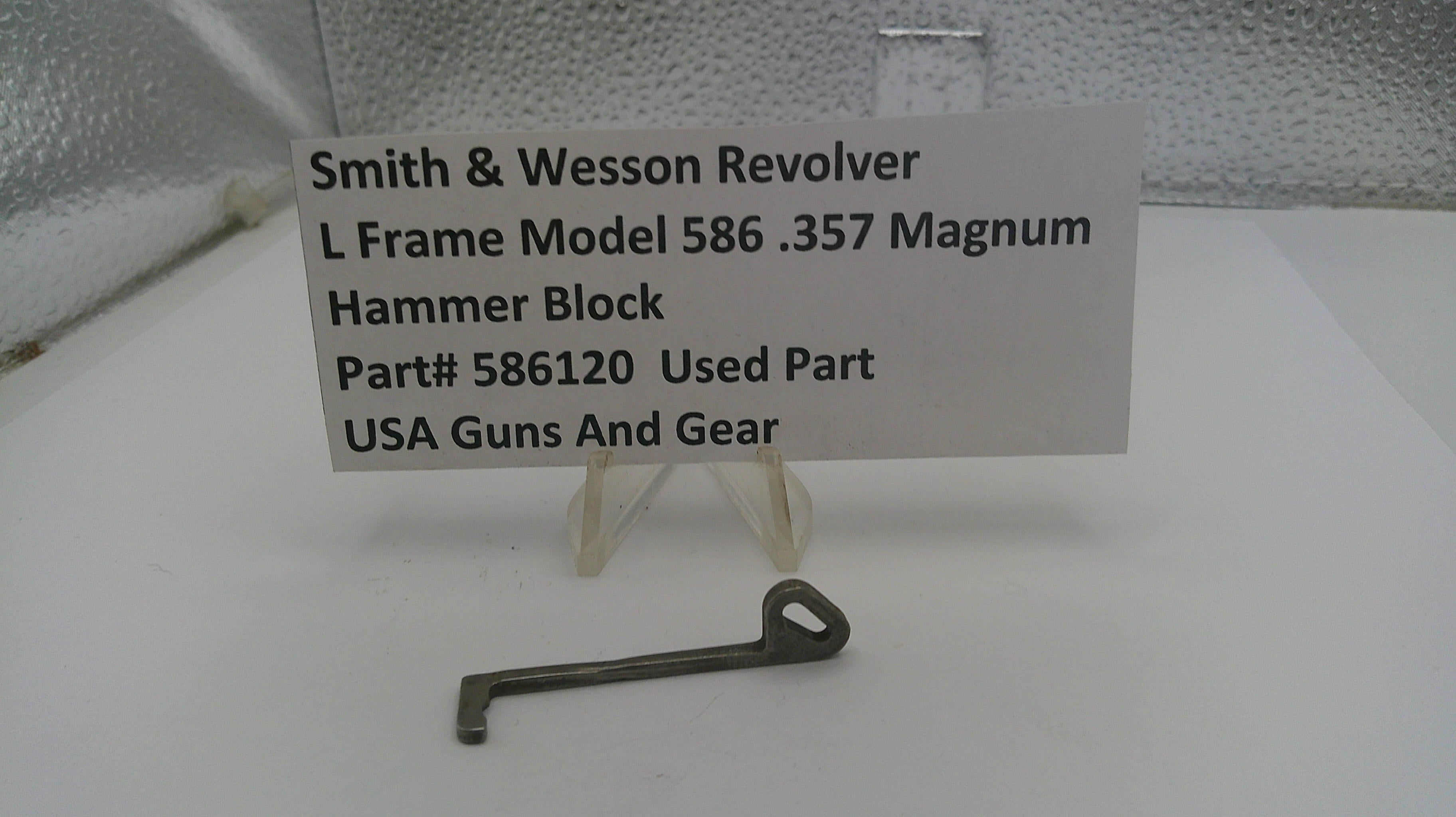 Smith & Wesson revolver hammer block part with a label on a white background