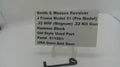 A small black metal hammer block part displayed on a clear stand in front of a white sign that reads 'Smith & Wesson Revolver J Frame Model 51 (Pre Model) .22 MRF (Magnum) .