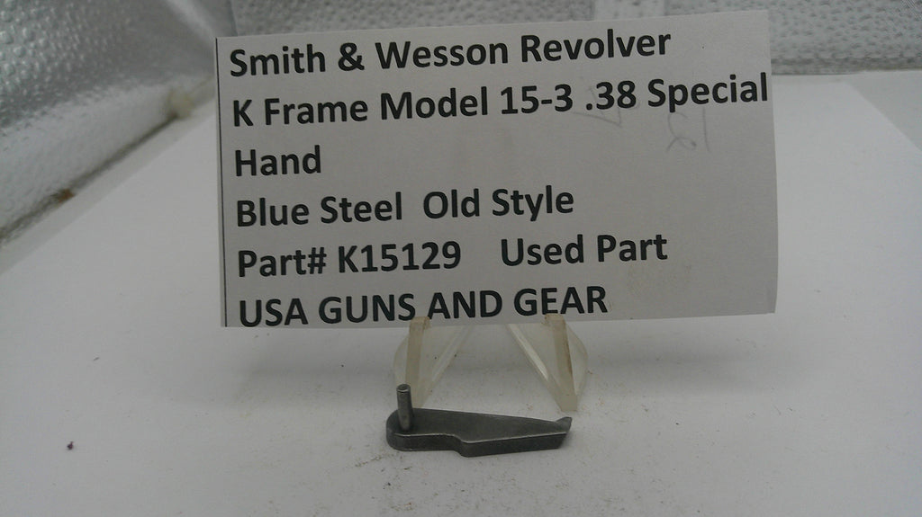 Smith & Wesson revolver part with descriptive label on a white surface