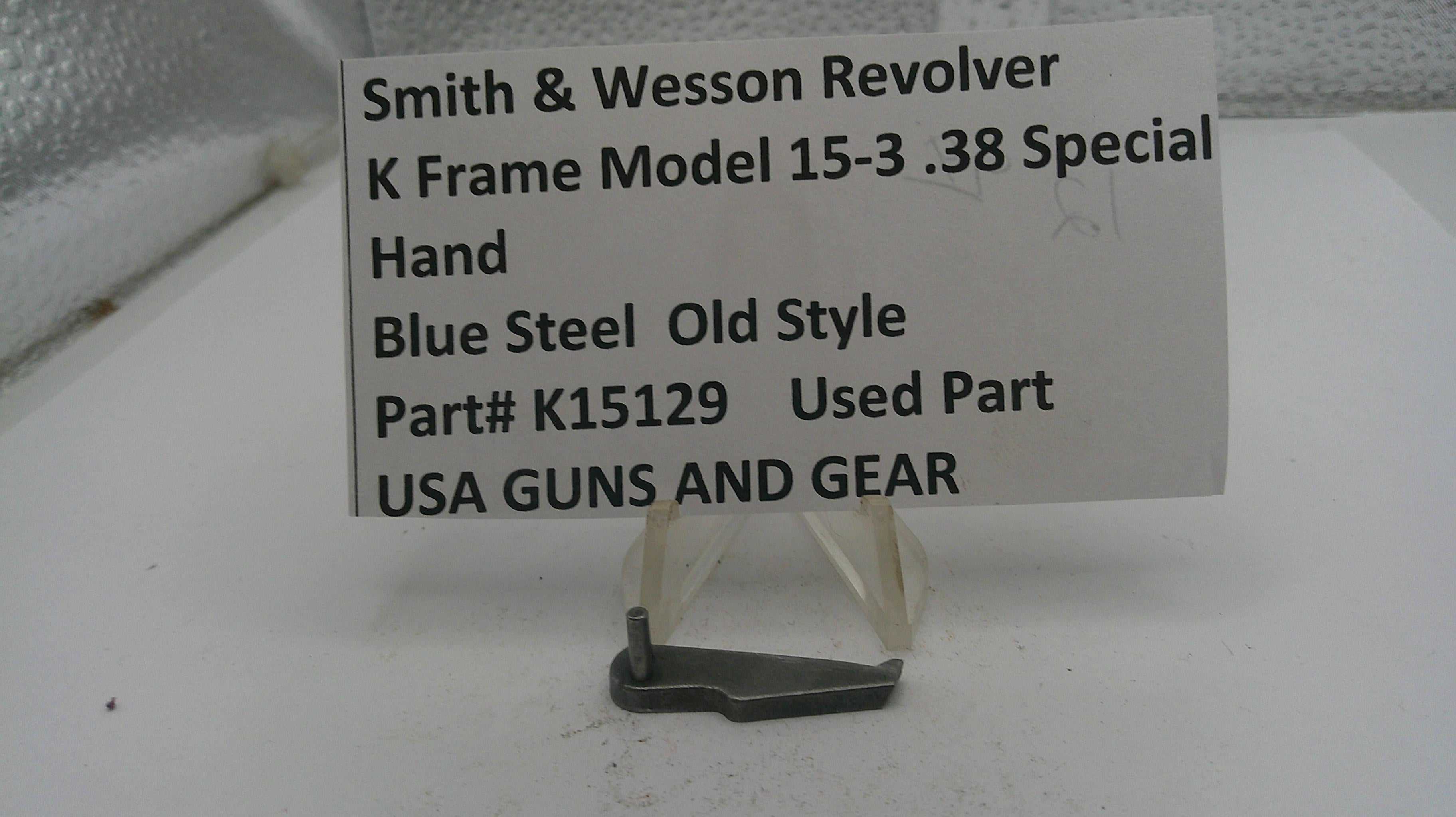 Smith & Wesson revolver part with descriptive label on a white surface