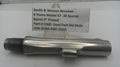 Metal gun barrel with a label detailing specifications on a white background