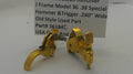 A pair of gold-colored metal hammer and trigger components for a J Frame Model 36 revolver, displayed on a white surface with a product information card in the background.