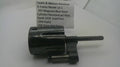 A used metal revolver cylinder component, identified as a Smith & Wesson Model 13-1 .357 Magnum blue steel cylinder with a yoke, displayed on a white background with a paper label.
