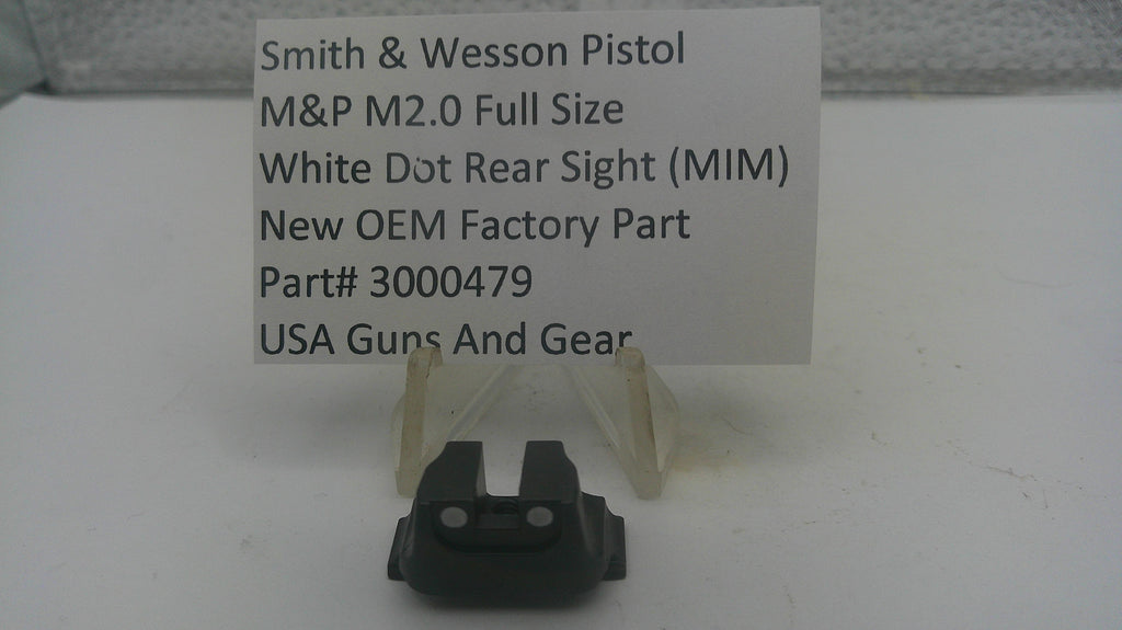 A black Smith & Wesson M&P M2.0 full-size white dot rear sight (MIM) part on a clear plastic display stand, with a white paper label card behind it on a white surface.
