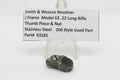 Smith & Wesson revolver part with descriptive label on a white background