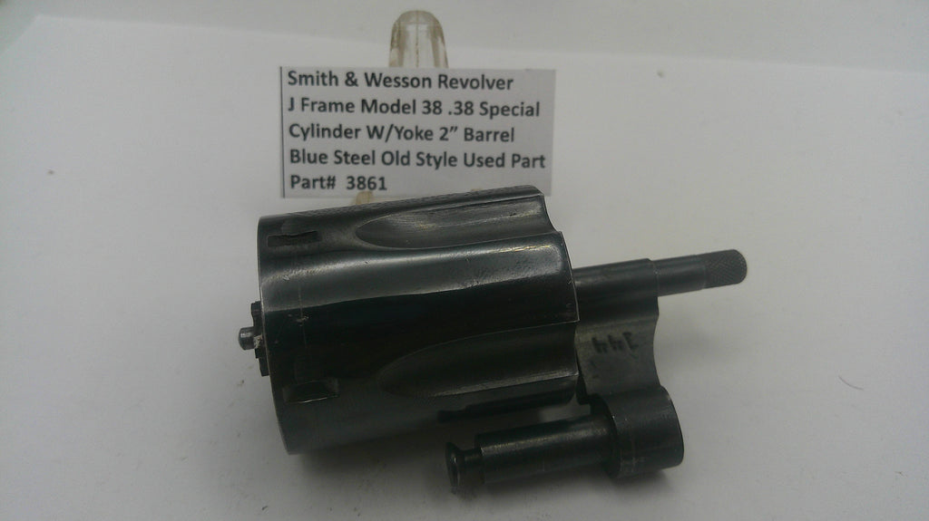 Smith & Wesson revolver cylinder with a label on a white background