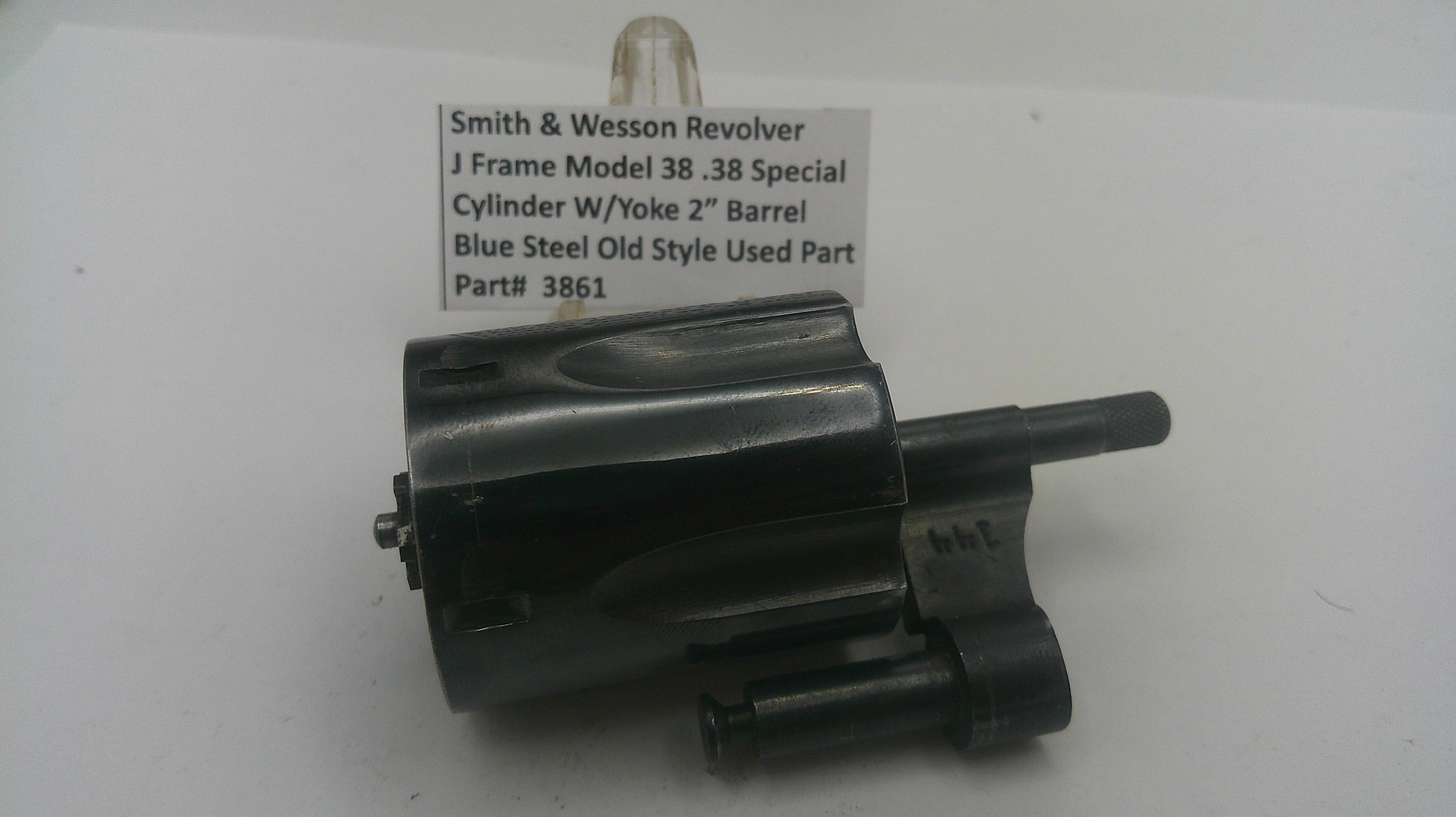 Smith & Wesson revolver cylinder with a label on a white background