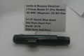 A black metal Smith & Wesson revolver, displayed on a white surface with a paper label card behind it containing product details.