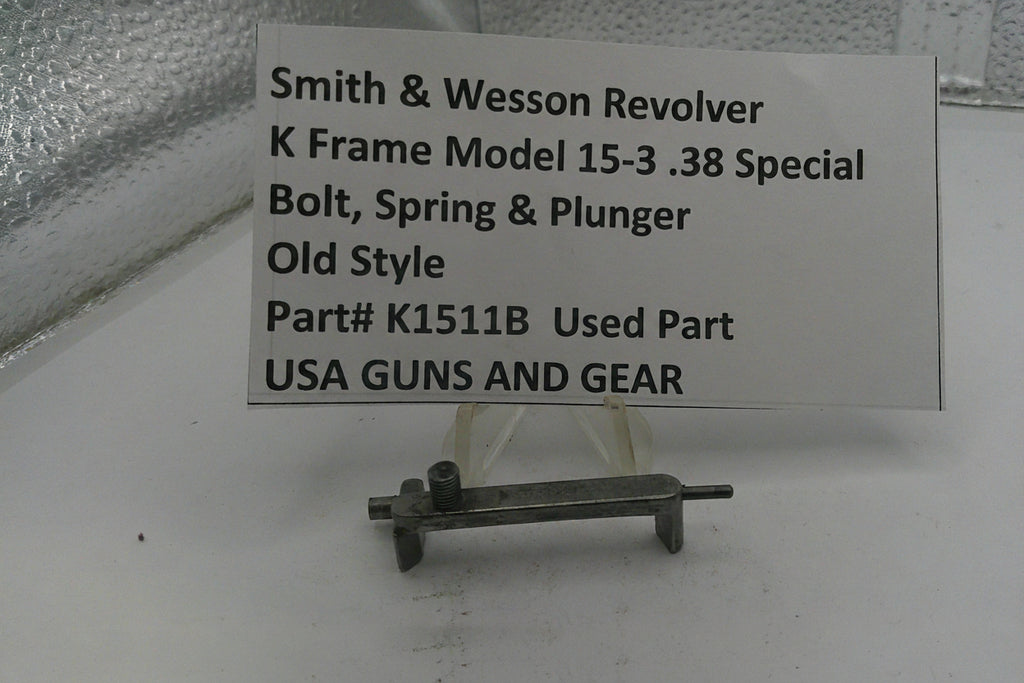 Smith & Wesson revolver part on a stand with descriptive label