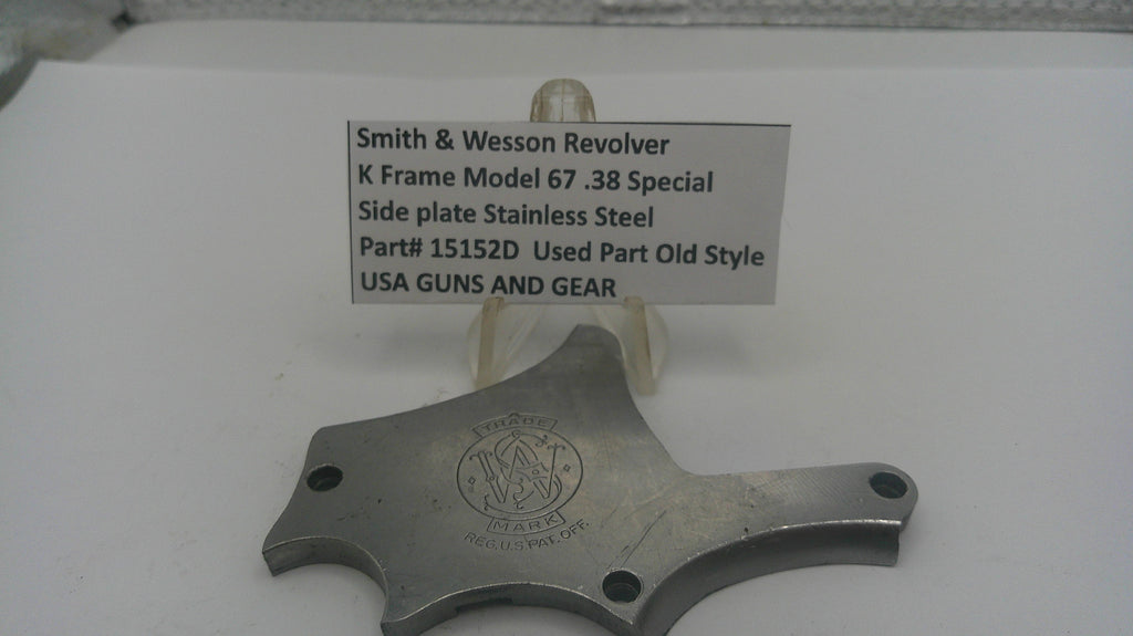 Smith & Wesson revolver side plate on a white background with a label.