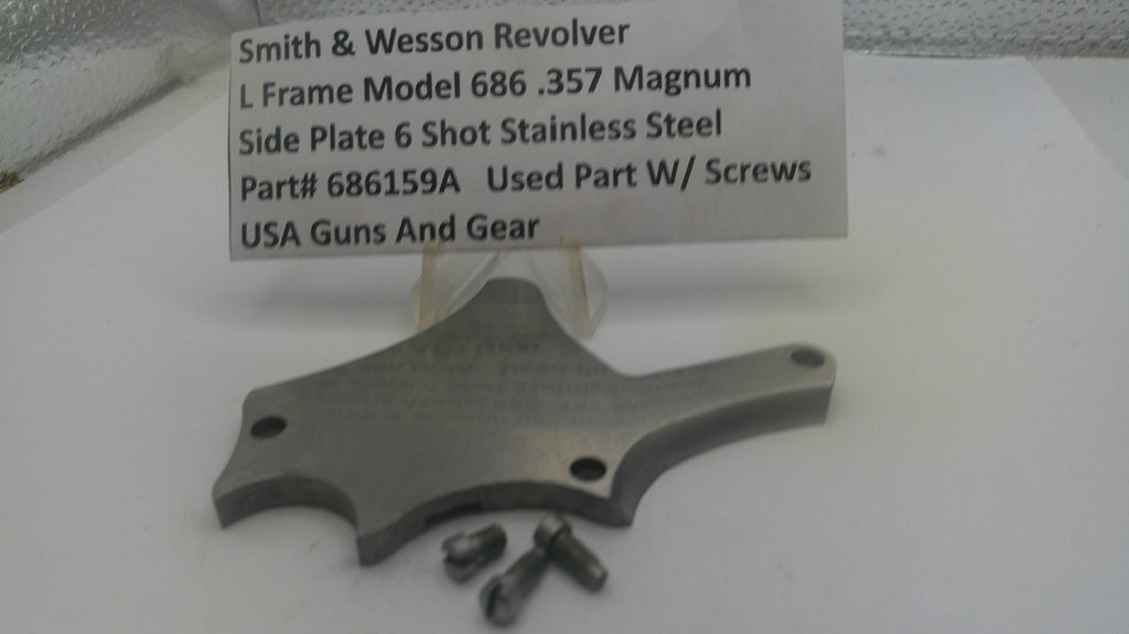 Smith & Wesson revolver side plate with screws on a white background, accompanied by a label.