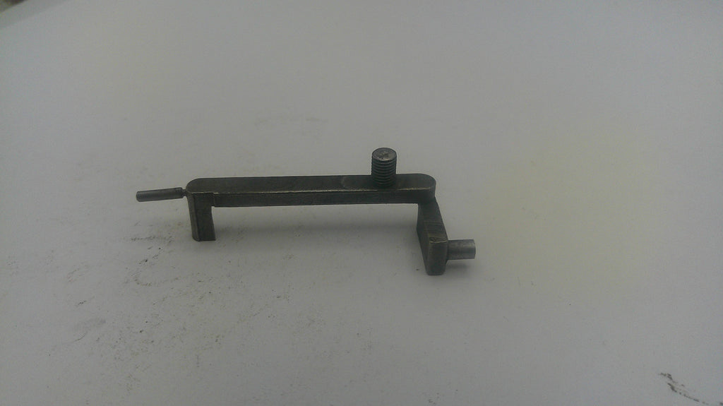Metal tool on a white surface