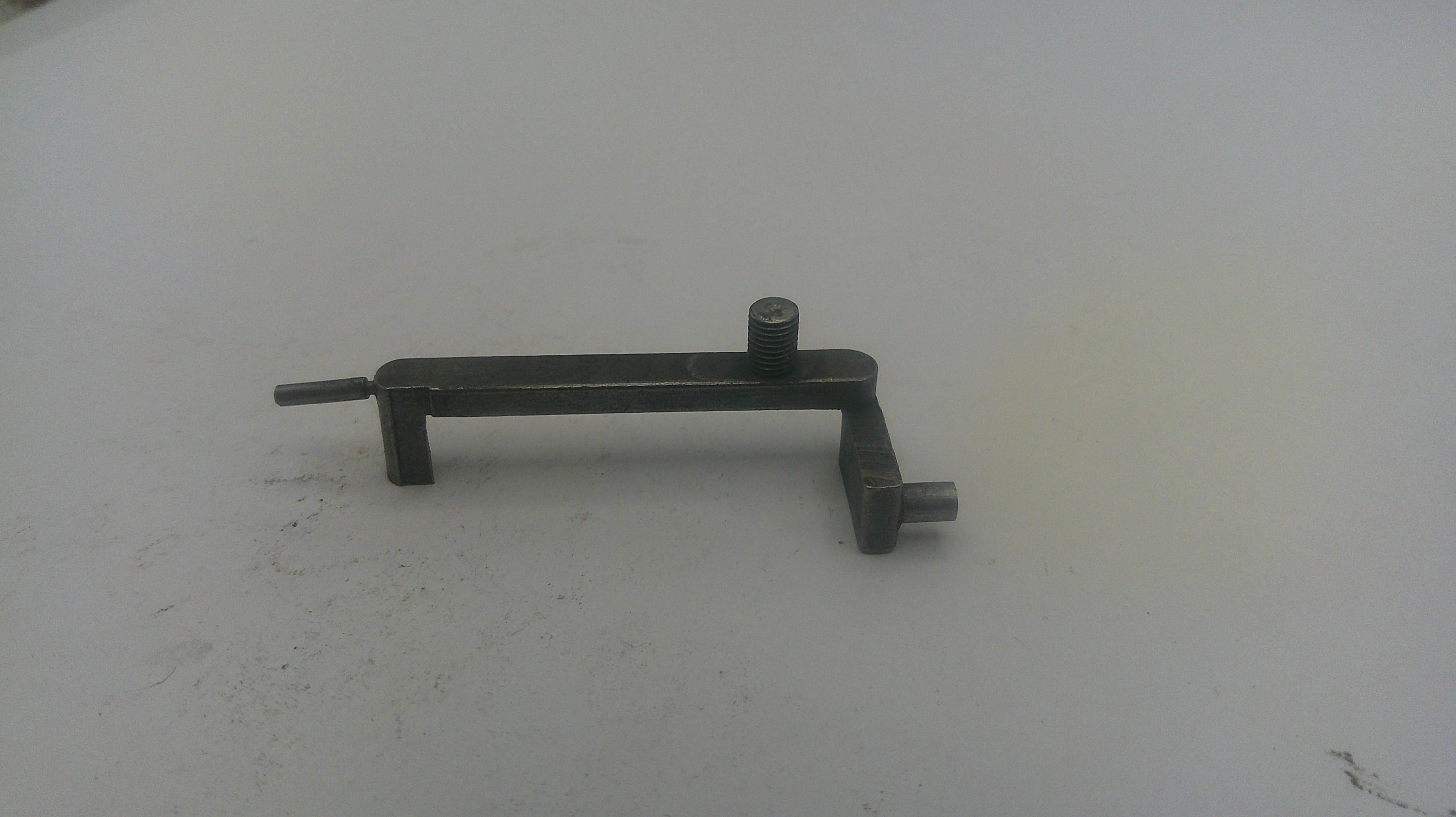 Metal tool on a white surface