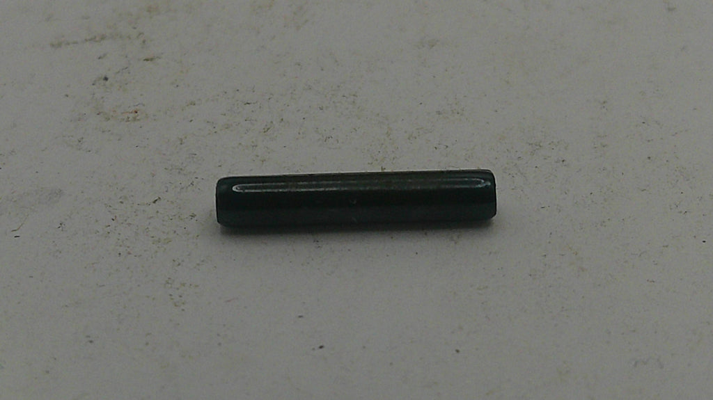 Black cylindrical object on a light gray background