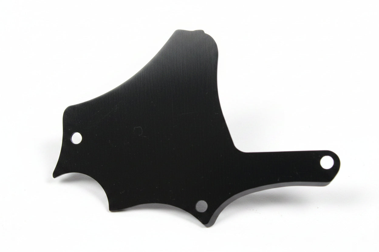 A dark brown tortoiseshell guitar pickguard with silver rivets, shown on a plain white background.