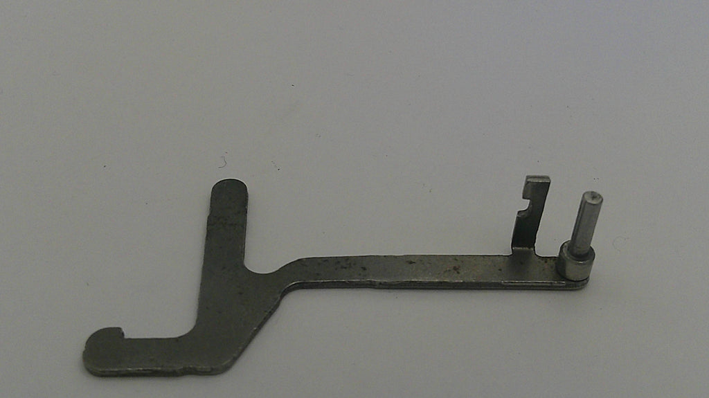 Metal tool or component on a gray background