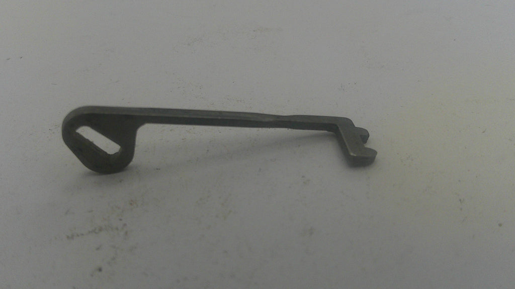 Metal key on a light gray background