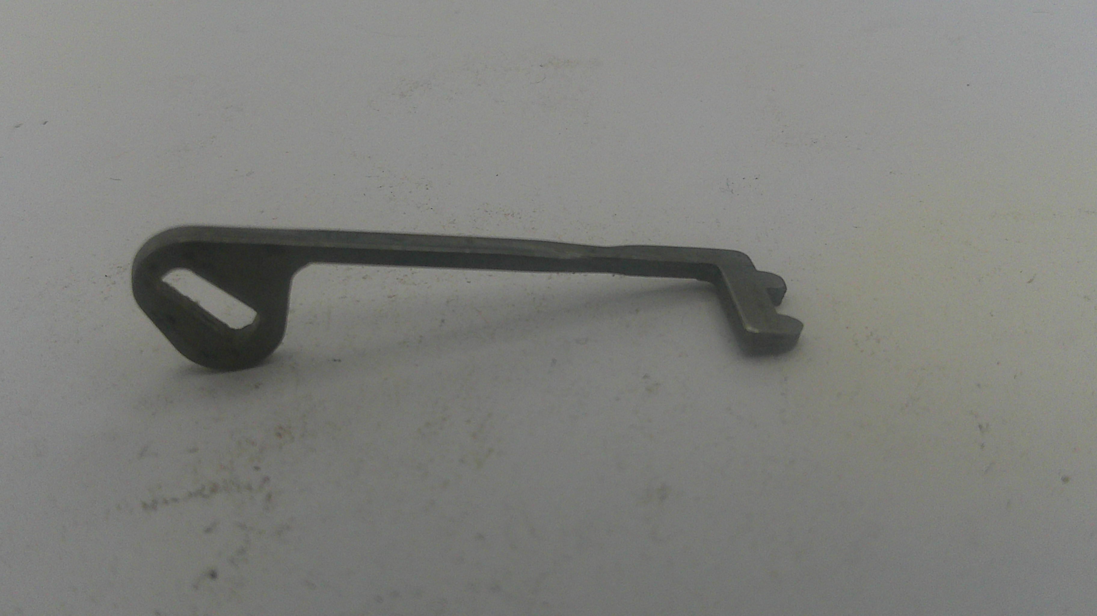 Metal key on a light gray background