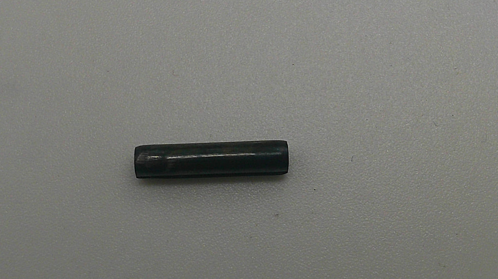 Black cylindrical object on a gray background